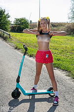 Nude teen on a scooter