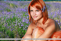 Violla a redhead violla a bares her sexy, tanned body and smooth pussy in the meadows.